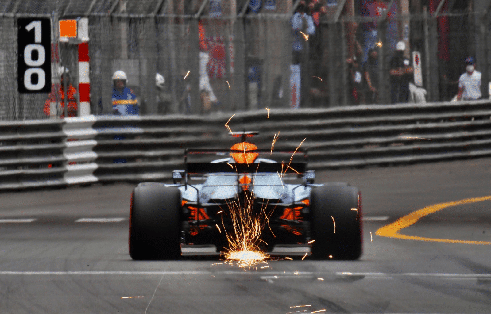 a man driving a racing car on a race track