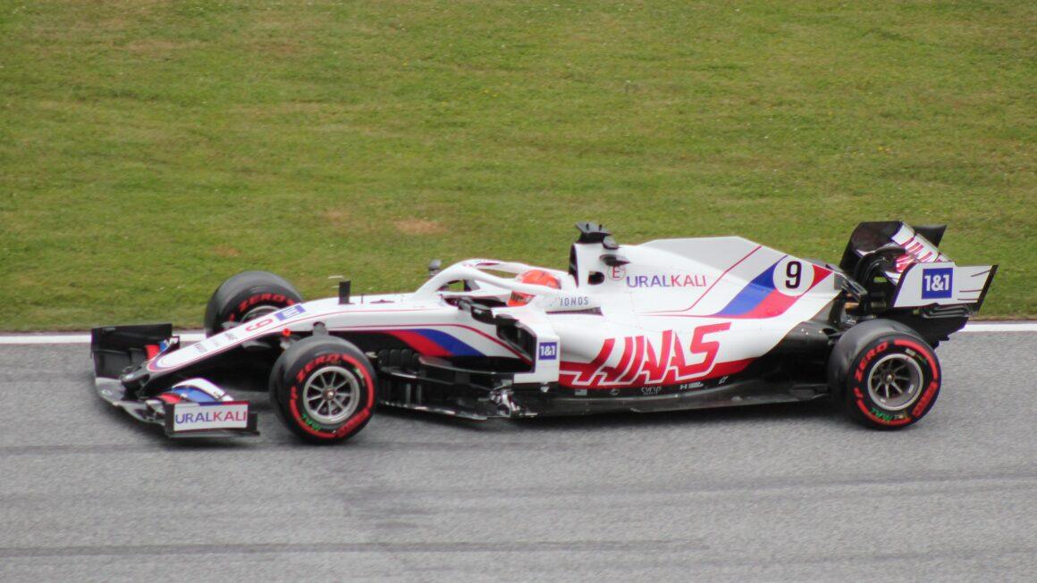a man driving a racing car on a race track