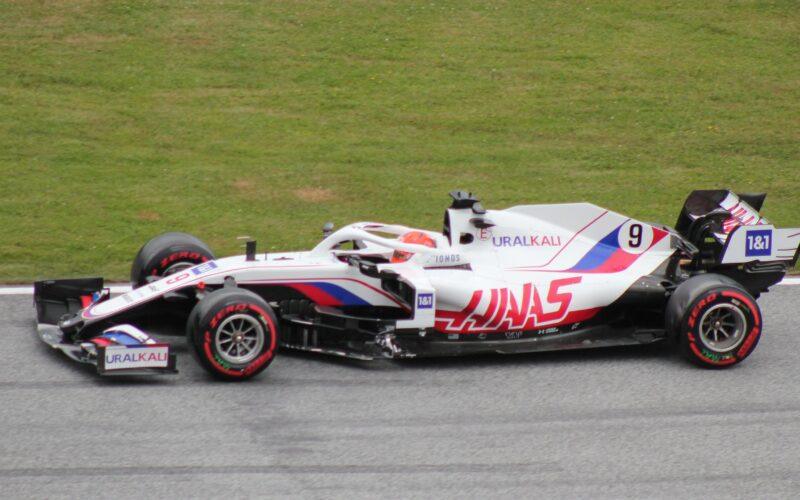 a man driving a racing car on a race track