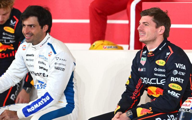 a couple of men sitting next to each other