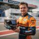lando norris unveils a unique helmet design to support the charity cause of a legendary f1 champion, blending racing heritage with philanthropy.